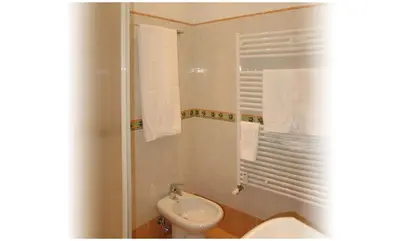 a bathroom with a toilet and a sink at Gaia's Room B&B in Rome