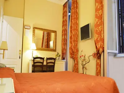 a hotel room with a bed and a mirror at Residenza Domiziano in Rome