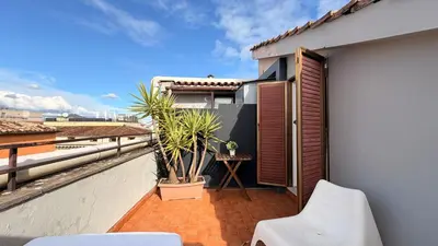 a balcony of a house with a plant on it at Hotel Concorde in Rome