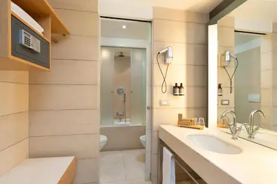 a bathroom with a sink and a toilet at Precise House Mantegna Roma in Rome
