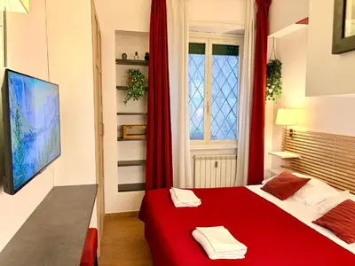 a bedroom with two towels on a bed at Internouno in Rome