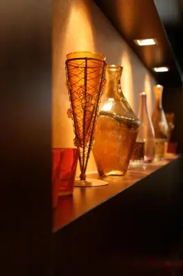 a shelf with several vases sitting on it at Hotel Latinum in Rome