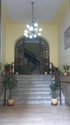 a staircase in a building with a chandelier at Hotel Ventura in Rome