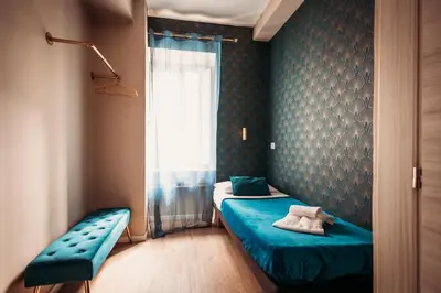 a small room with two beds and a window at Hotel Domus Tiberina in Rome
