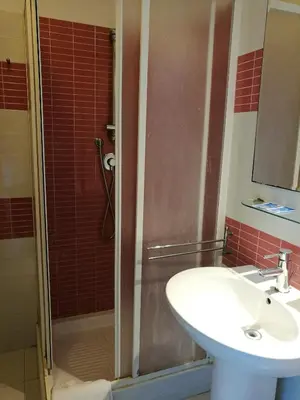 a bathroom with a sink and a shower at Serendipity in Rome