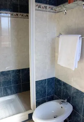 a bathroom with a sink and a toilet and a shower at Città Eterna Guest House in Rome