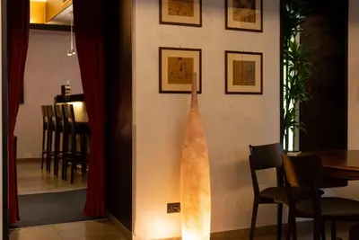 a wooden surfboard on the wall of a restaurant at Hotel Re Di Roma in Rome
