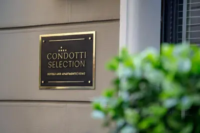 a sign on the wall of a building at Condotti Boutique Hotel in Rome
