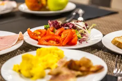 three plates of food on a table with plates of food at Hotel Delle Nazioni in Rome