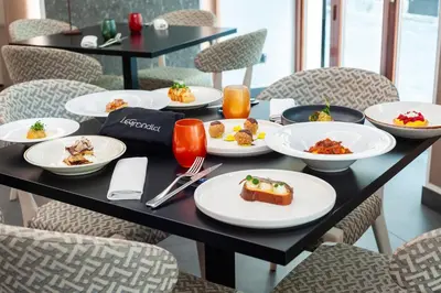 a table with plates of food on it at Hotel Delle Nazioni in Rome