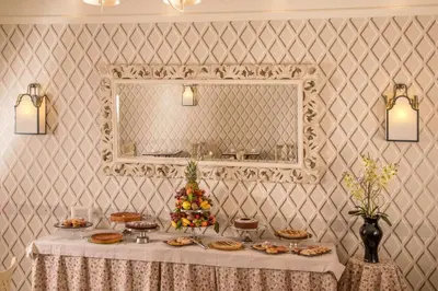 a table with a christmas tree on it in front of a mirror at Hotel Villa Glori in Rome