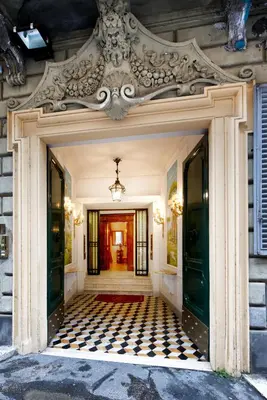 an entrance to a house with a checkered floor at Suite Opera Rooms in Rome