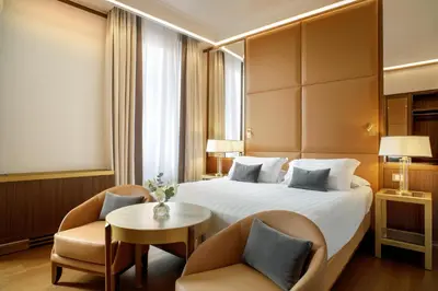 a hotel room with a large bed and a window at Hotel Imperiale by OMNIA hotels in Rome