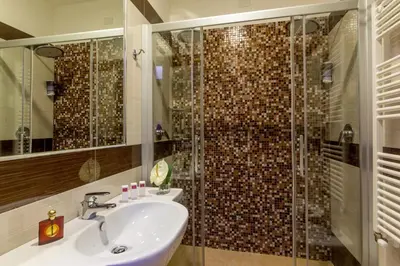 a bathroom with a sink and a shower at Hotel Dei Mille in Rome