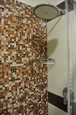 a bathroom with a shower with a glass door at Hotel Dei Mille in Rome