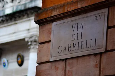 a sign on the side of a brick building at Locanda degli Antiquari in Rome