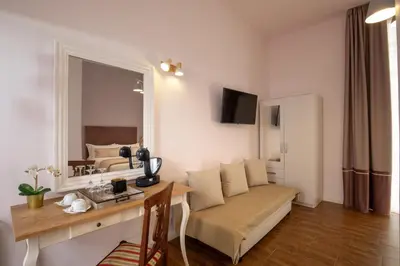 a living room with a couch and a table in a room at Juno Pantheon in Rome