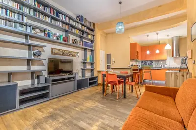 a living room with a kitchen and a dining room at Il gazebo a Monteverde in Rome