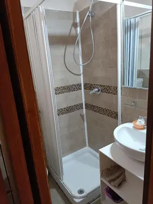 a bathroom with a shower and a sink at Enjoy Roma in Rome