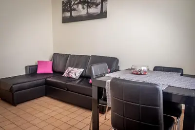 a living room with a couch and a table at San Pietro's Home in Rome