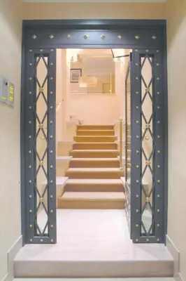 a door leading up to a set of stairs at Colosseo Studio Suite in Rome
