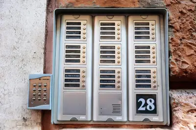 a set of four computer systems on a wall at Cardinal Vatican Inn in Rome