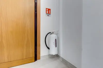 a fire hydrant in a room next to a door at Vatican 96 Degli Ubaldi Charming Suite with terrace in Rome