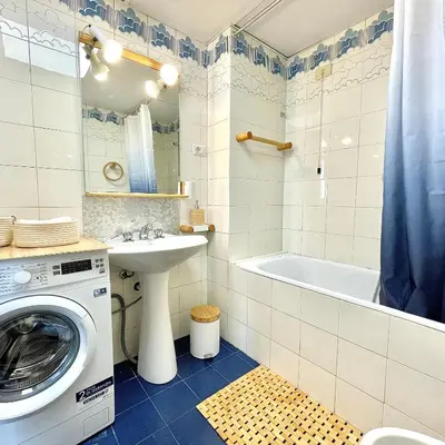 a bathroom with a washing machine and a sink at E&E Guest House in Rome