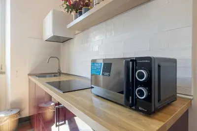 a microwave oven sitting on a counter in a kitchen at CHARMING APARTMENT AT SPANISH STEPS, no elevator in Rome