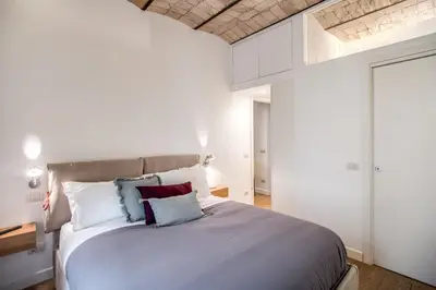 a bedroom with a large bed with pillows on it at PgrHome Borgo Vittorio in Rome
