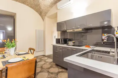 a kitchen with a sink and a counter top at Daplace - Lucia Apartment in Rome