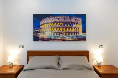 a painting of the colosseum at night at Pigneto Vannini Roma in Rome
