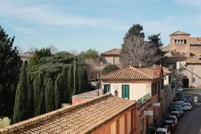 a town with cars parked on the side of a street at Colosseum - Charme Holidays in Rome