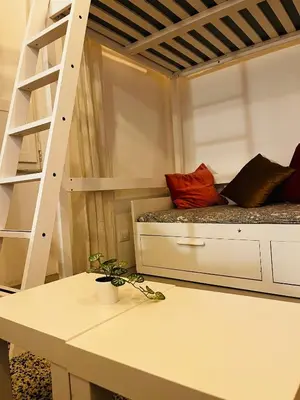 a room with a bunk bed and a ladder at Sweet Life House Rome Cavour in Rome
