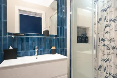 a bathroom with a sink and a shower at Veniero37 Guest House in Rome