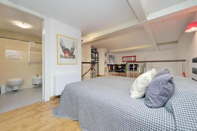 a bedroom with a bed and a bathroom at Design accommodation in Rome