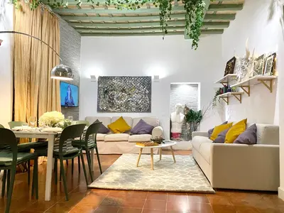 a living room with a couch and a table at Pantheon Ancient Rome Apartment in Rome
