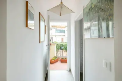 a hallway with a door leading to a patio at Bright Penthouse Downtown in Rome