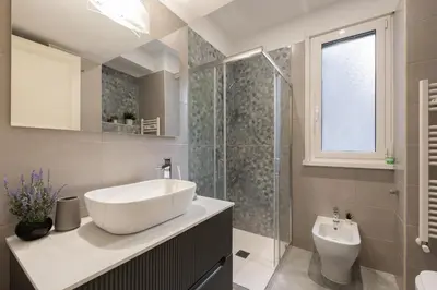 a bathroom with a sink and a shower at Campo de' Fiori appartamento via di Grotta Pinta in Rome
