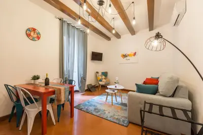 a living room with a table and a couch at Campo de' Fiori appartamento via di Grotta Pinta in Rome