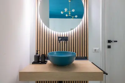a bathroom with a blue bowl on a wooden vanity at LABICANA Apt - Colosseum in Rome