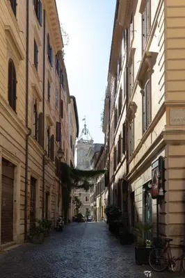 an empty street in a city with buildings at Navona Harmony Apartments in Rome
