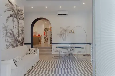 a living room with a white couch and a table at Navona Harmony Apartments in Rome