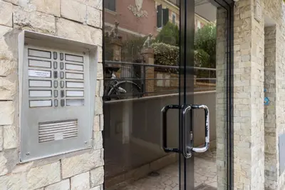 a glass door to a building with a window at Daniela's Place in Rome