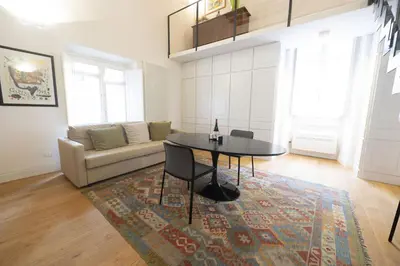 a living room with a table and a couch at Charm and Style by Campo de Fiori in Rome