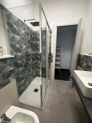 a bathroom with a shower and a sink at DOMUS H501 in Rome