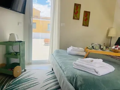 a room with towels on a bed with a window at Monteverde Double Terrace Penthouse in Rome