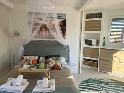 a bedroom with a bed with a tray of food on it at Monteverde Double Terrace Penthouse in Rome