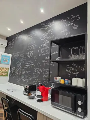 a black wall with writing on it in a kitchen at Moderno appartamento Cornelia-San Pietro con Giardino in Rome