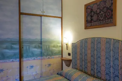 a room with a couch and a large window at Angel's Terrace in Rome
